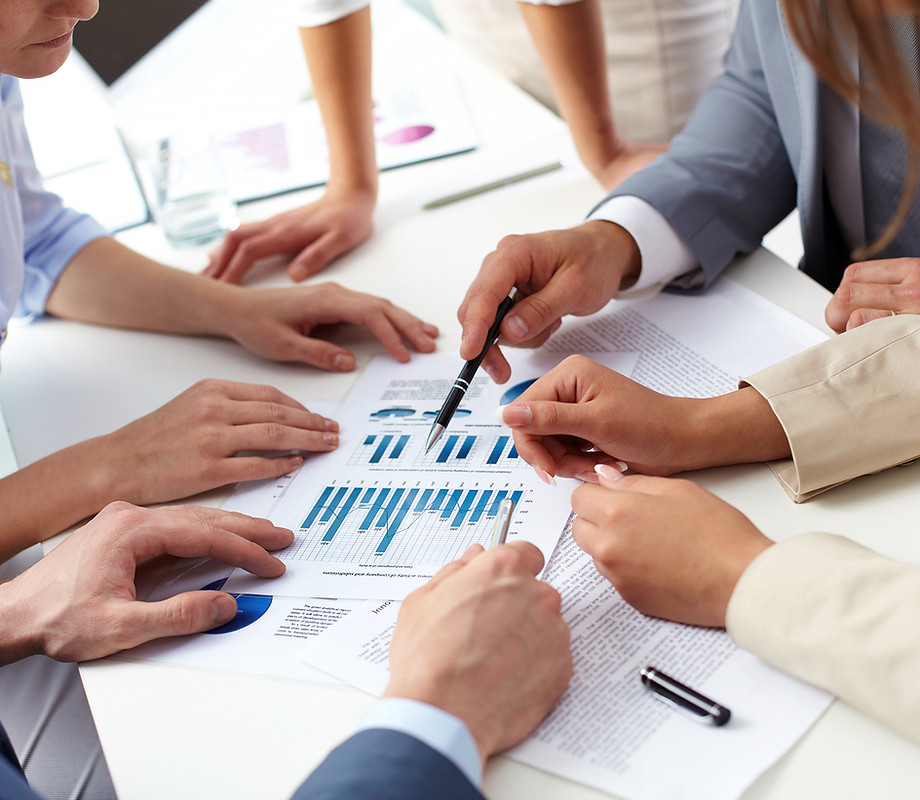 Consultants reviewing business figures